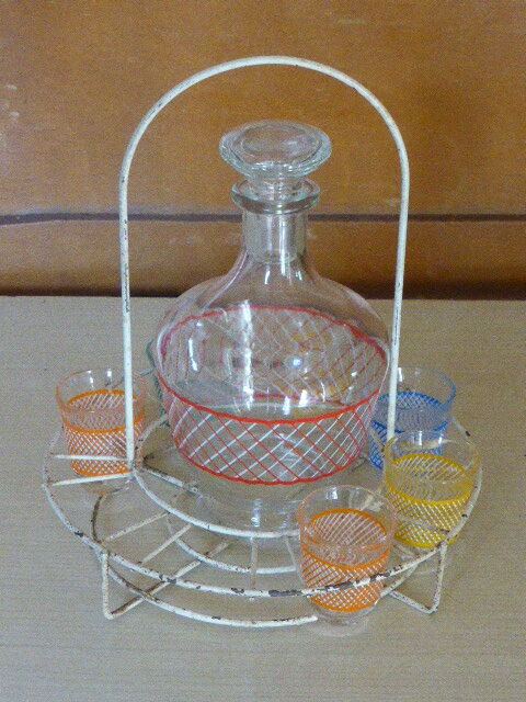 Service a Liqueur consisting of a metal servant, a carafe and 6 small vintage glasses 1950