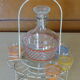 Service a Liqueur consisting of a metal servant, a carafe and 6 small vintage glasses 1950