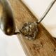 Pair of antique wrought iron coat hooks mounted on a wooden panel, 19th century
