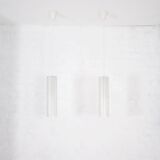 Doria pendant lights in lined frosted glass.
