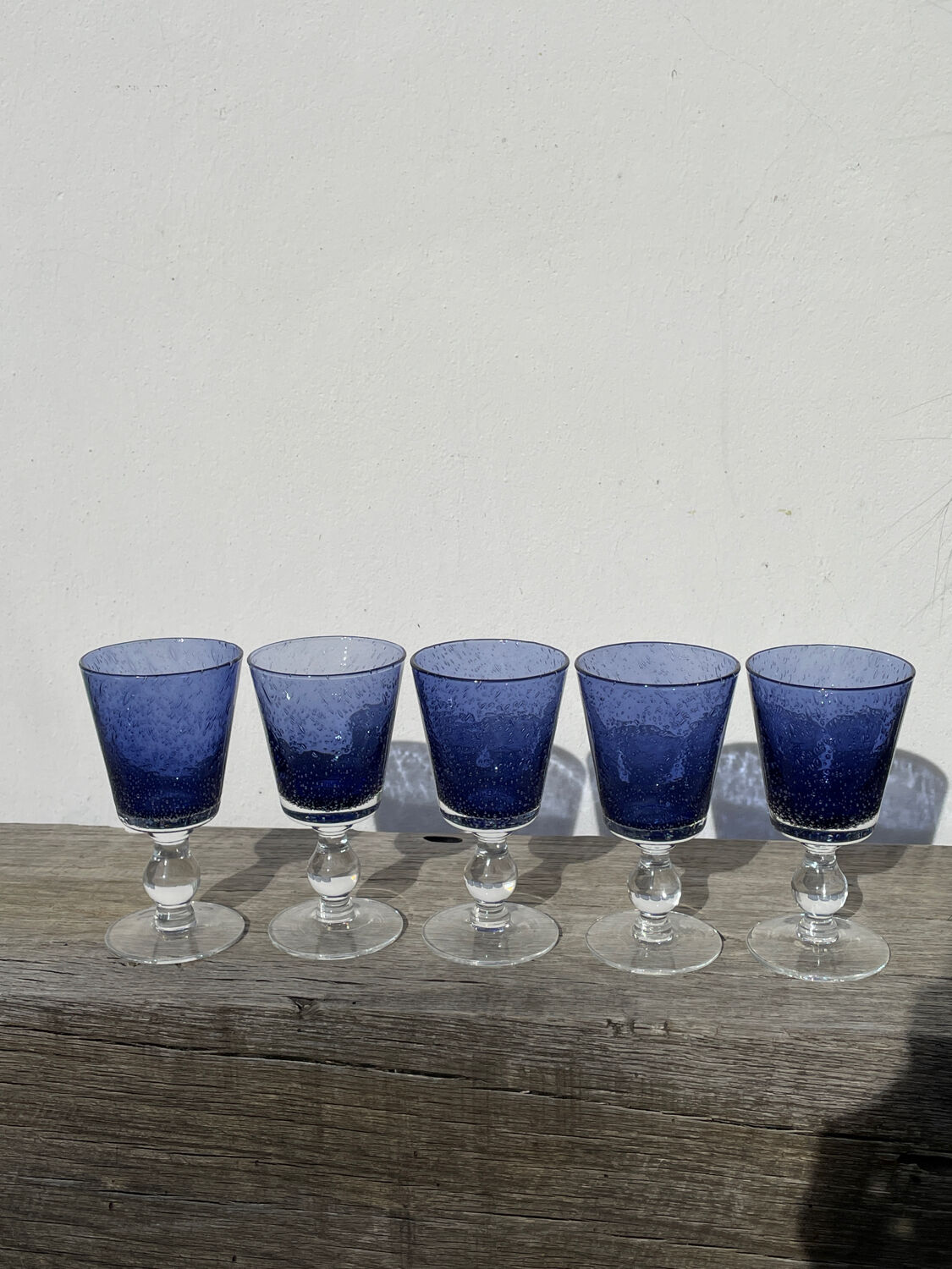 Set of 5 blue bubble stemmed glasses