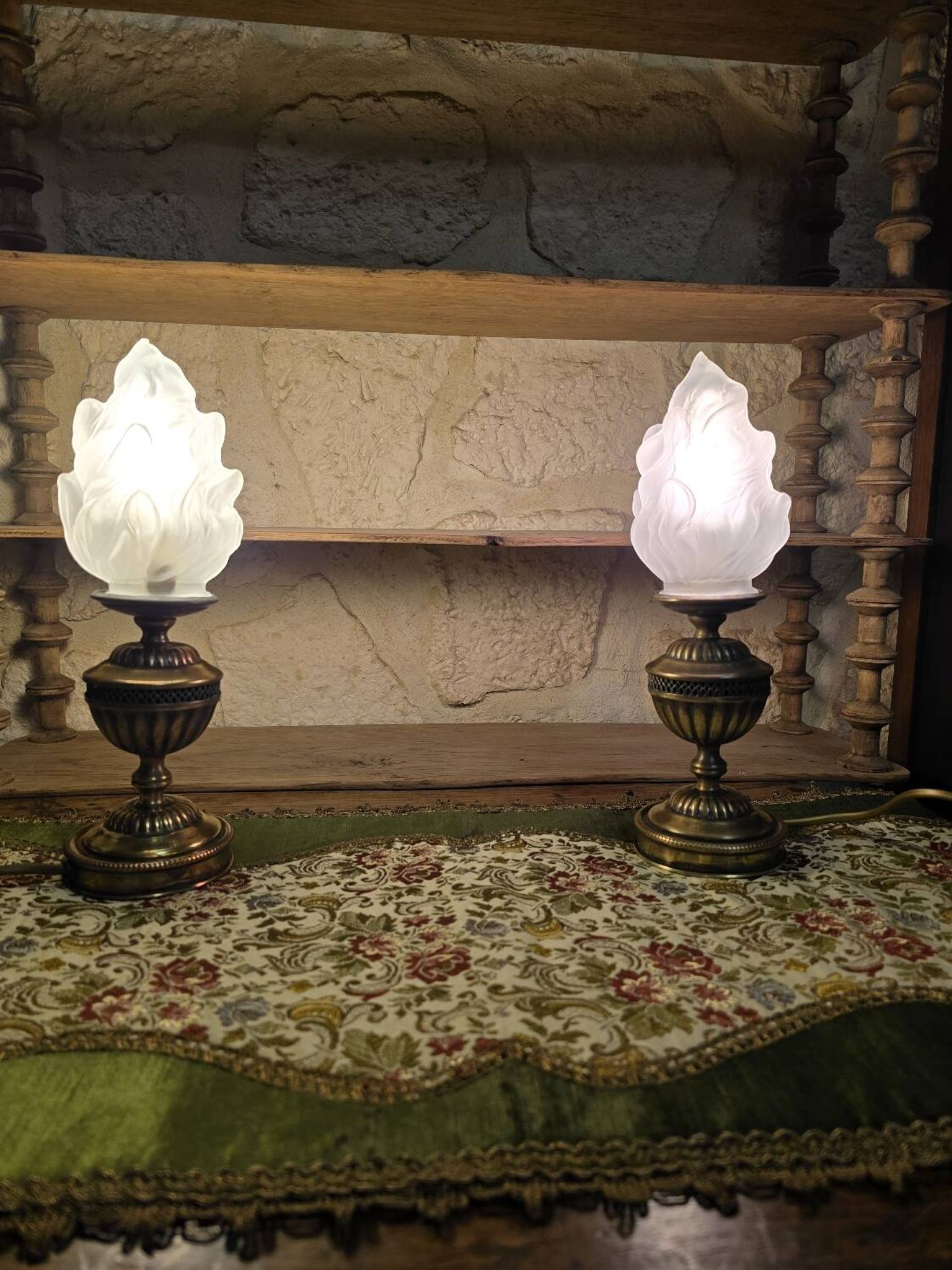 Small globe lamp with flame and brass base for oil.