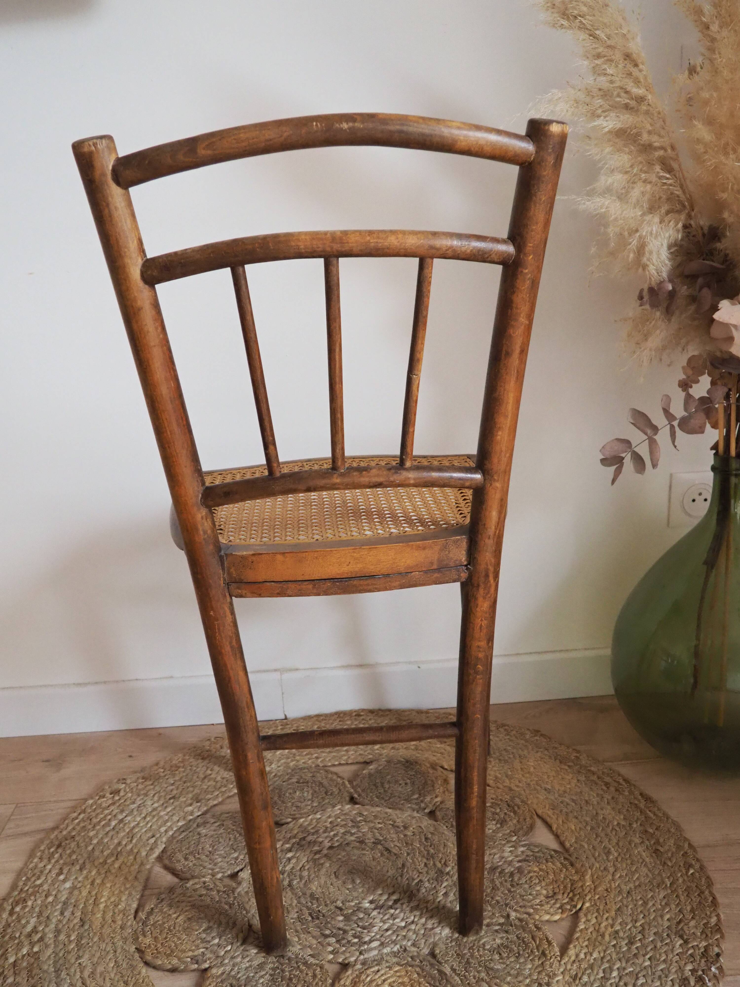 Wooden chair with cane seat