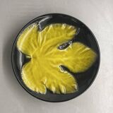 Wall plate by Pol Chambost with leaf pattern.