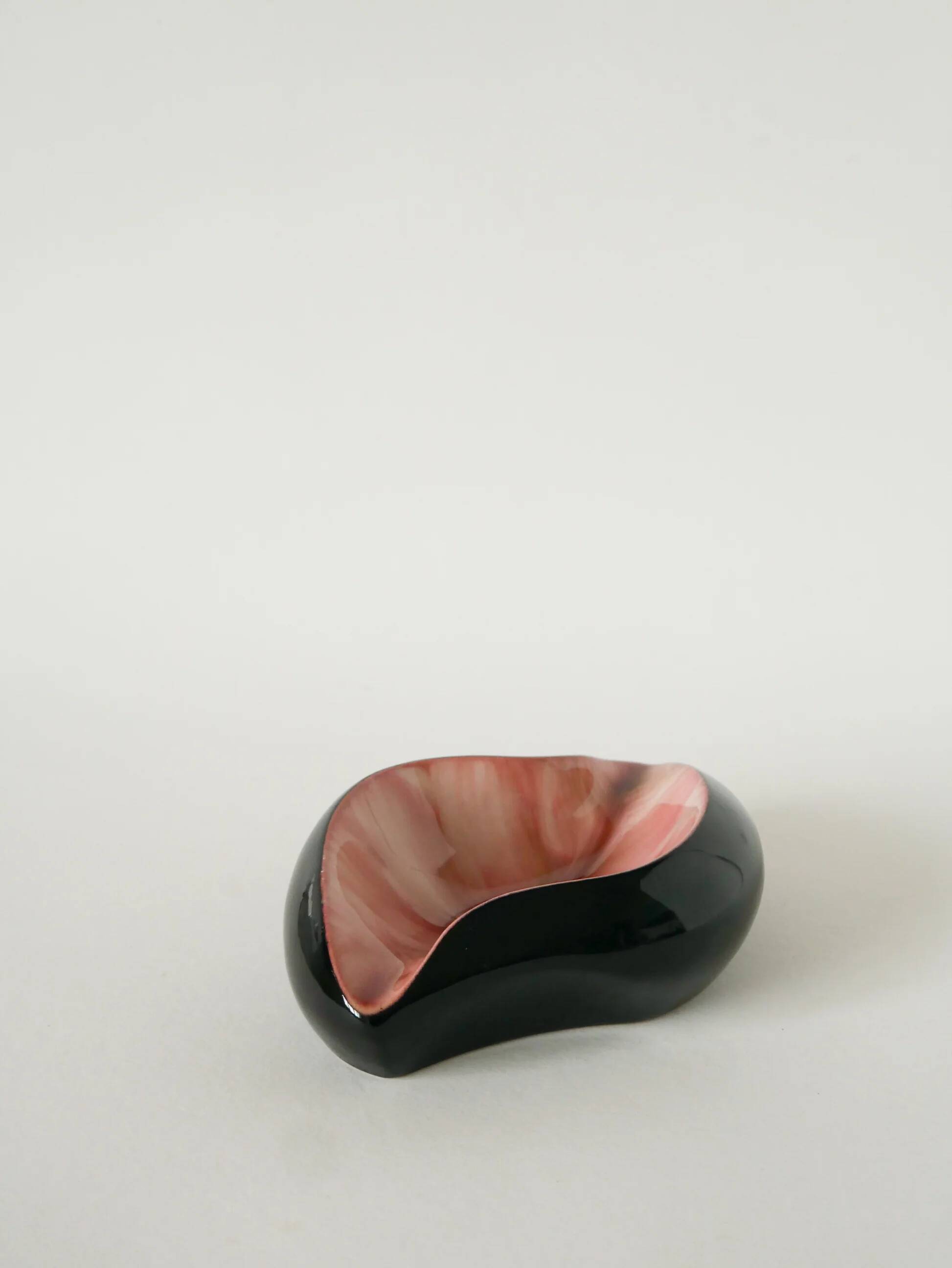 Ceramic catchall, free form, black and pink, 1970.