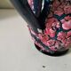 Vintage pitcher in midnight blue glazed ceramic with bright pink relief