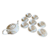 Very elegant teapot and its 8 cups.