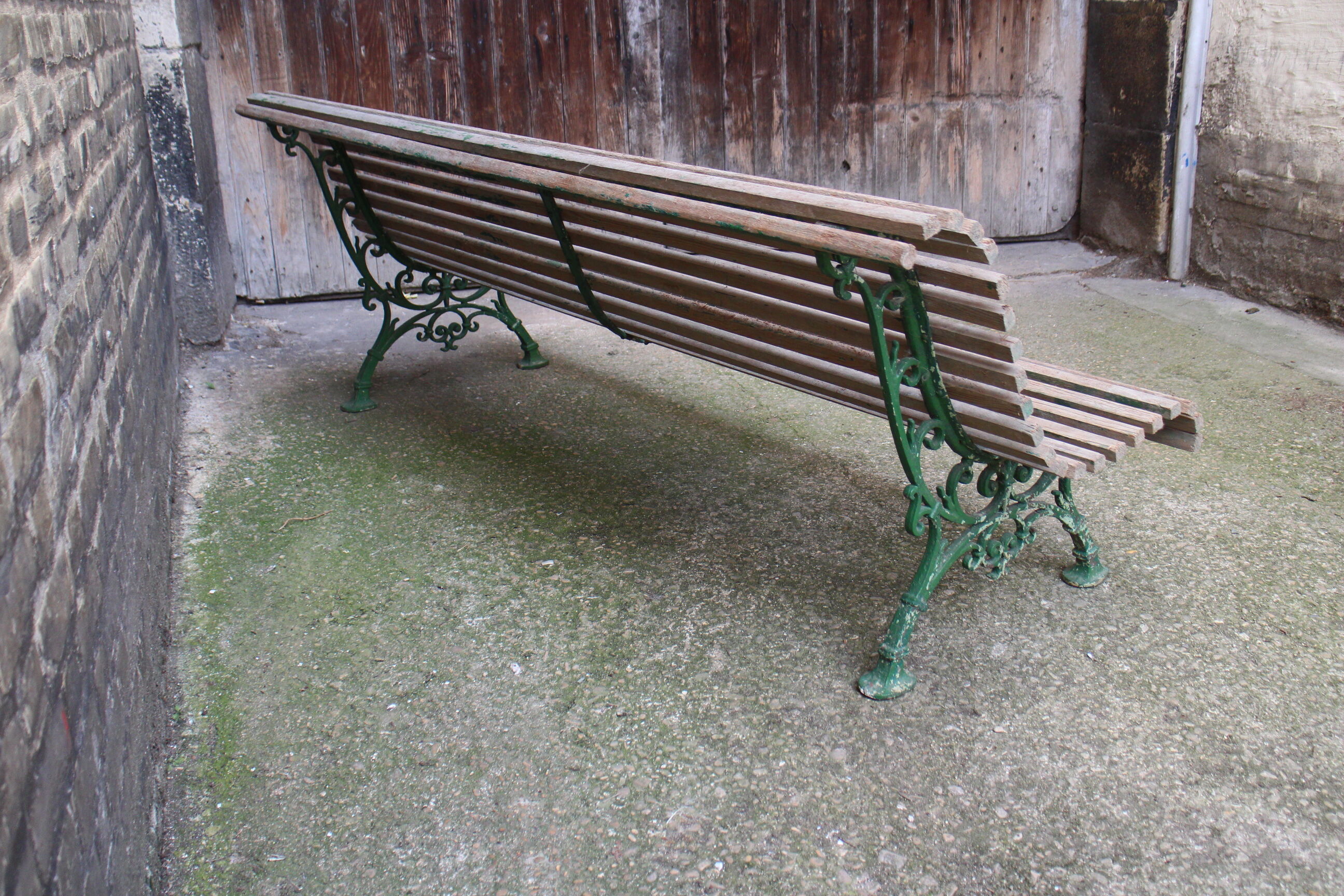 Old bench cast iron base and wooden slats