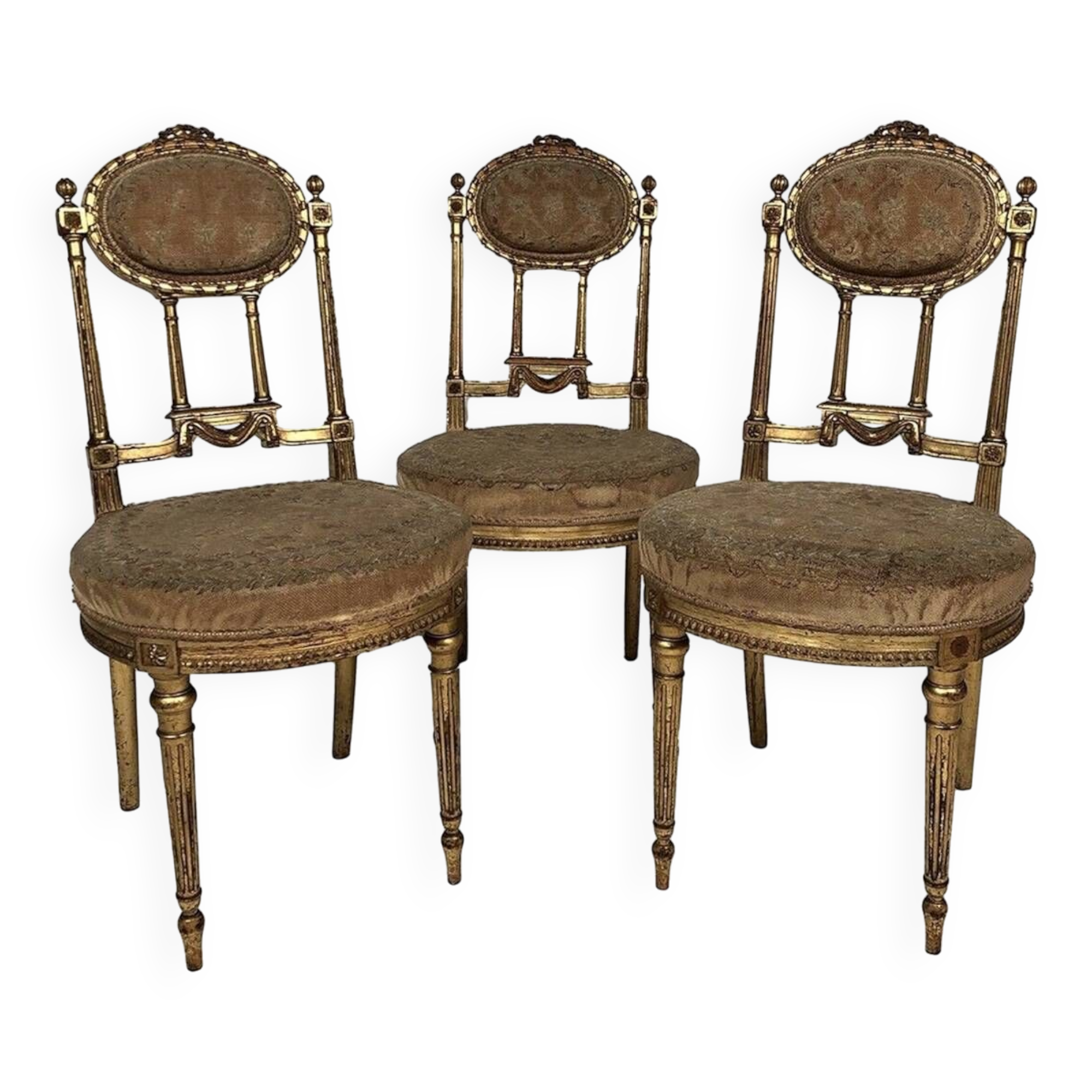 Series of three Louis XVI style chairs in gilded wood, circa 1900