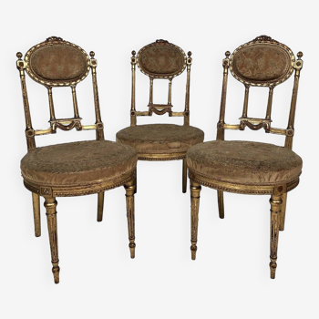 Série de trois chaises de style Louis XVI en bois doré, vers 1900