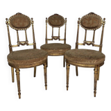 Series of three Louis XVI style chairs in gilded wood, circa 1900