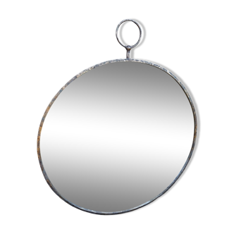 Round patinated mirror