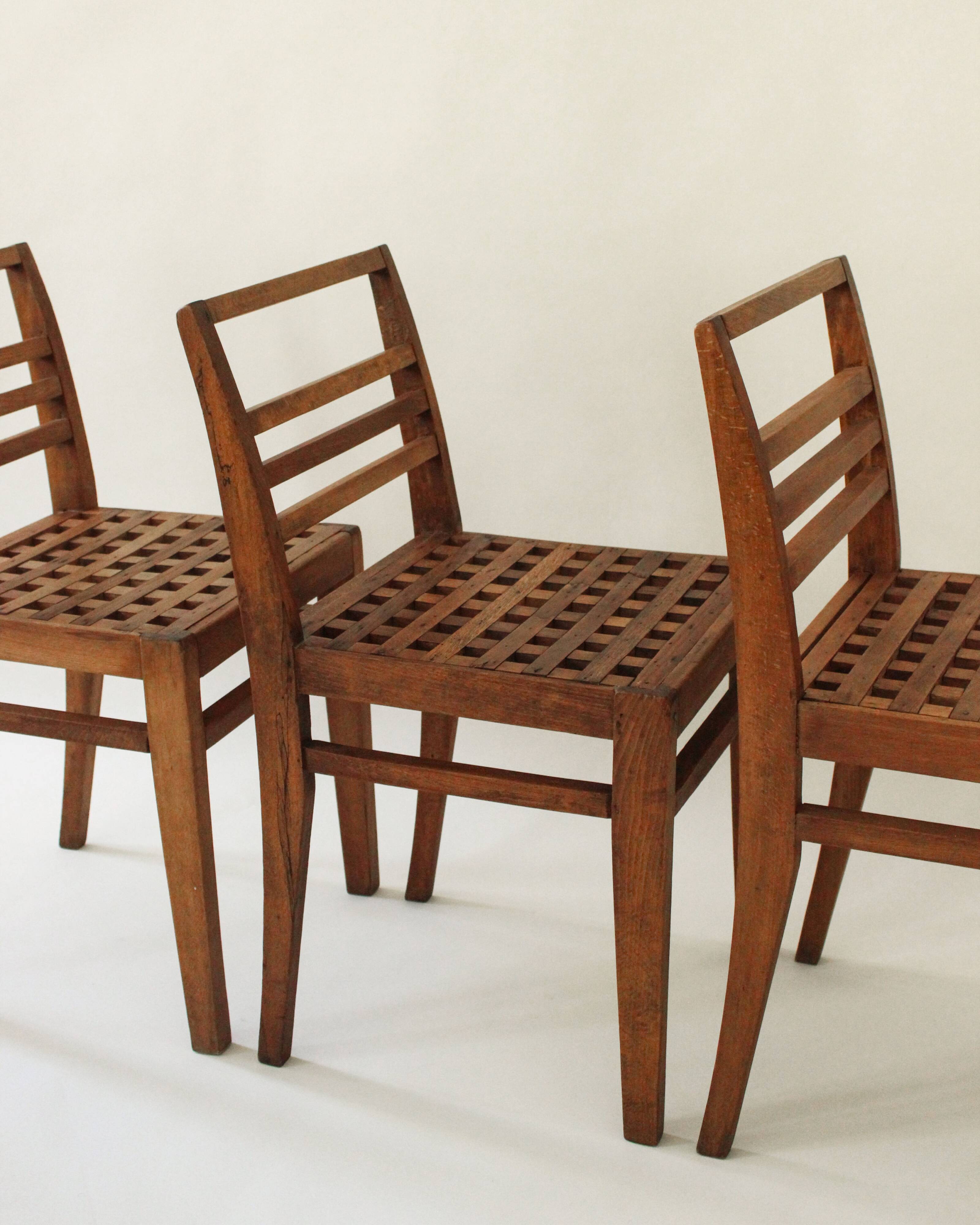 3 chairs model 103 with lattice seats by René Gabriel