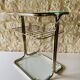 Glass and brass side table with magazine rack, circa 1970's