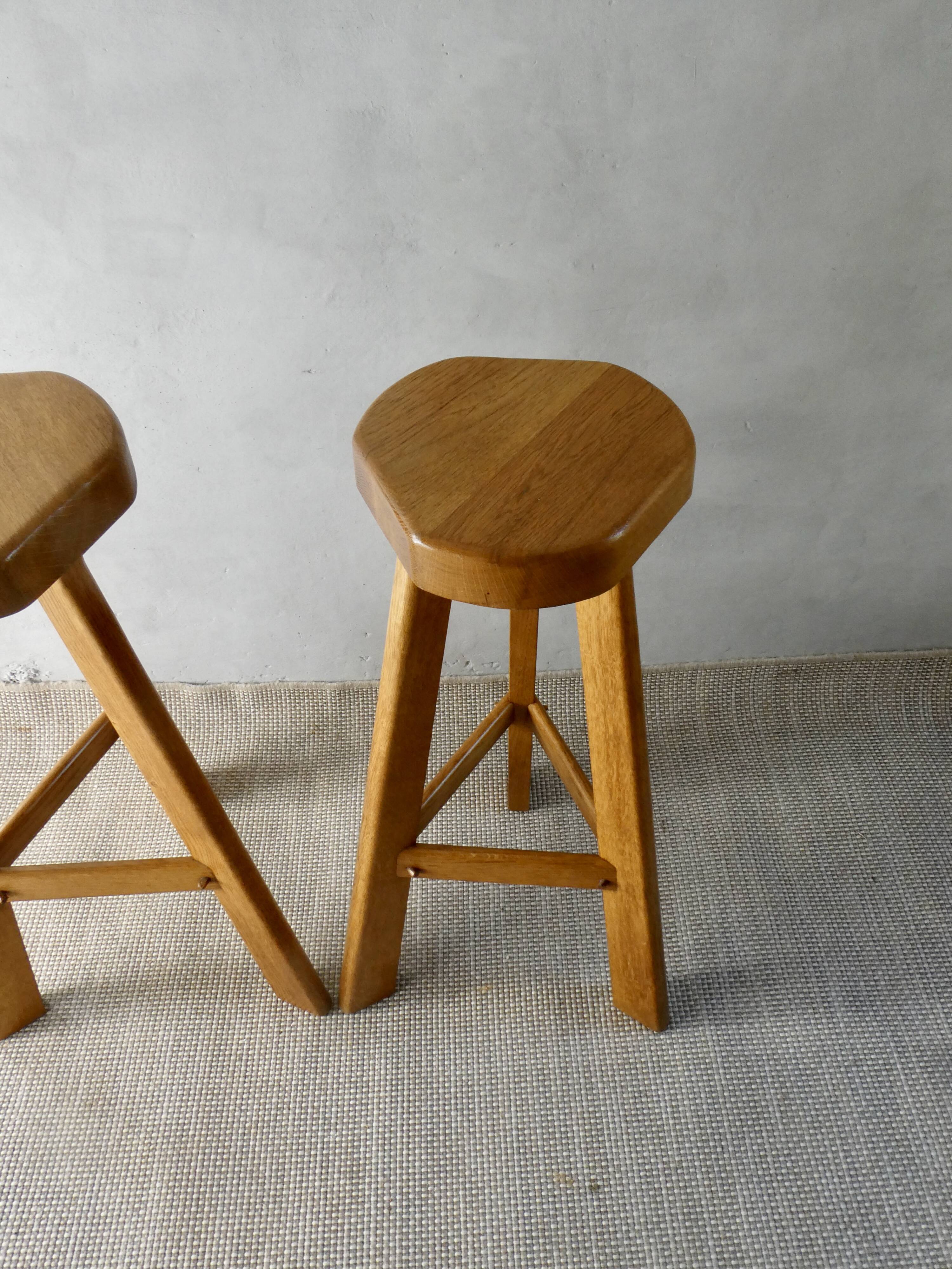 Pair of high bar stools, tripods, in solid wood