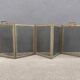 Antique fireplace screen in copper and brass from the 19th century.