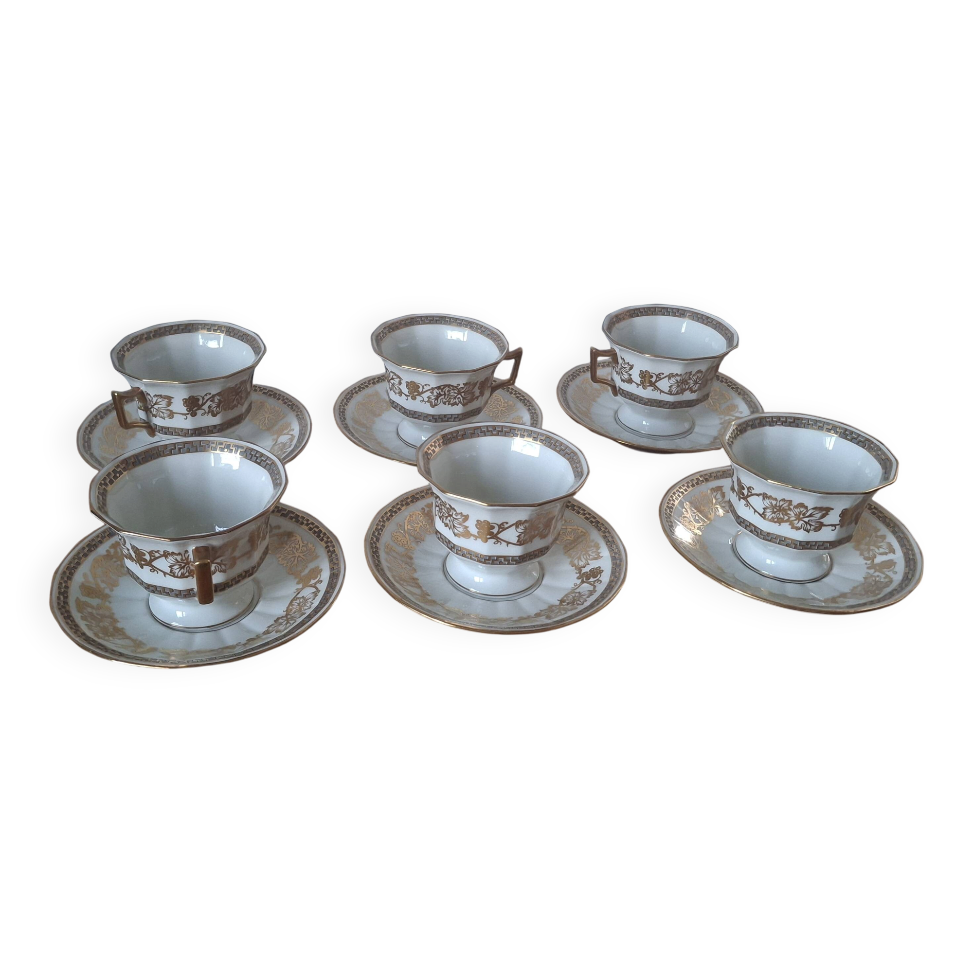 Set of 11 cups and saucers