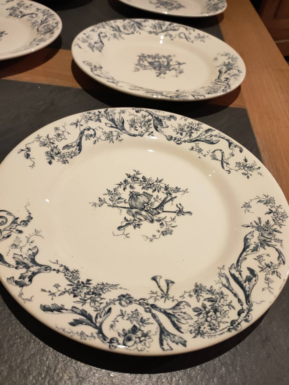 Service of old Gien earthenware plates and dishes