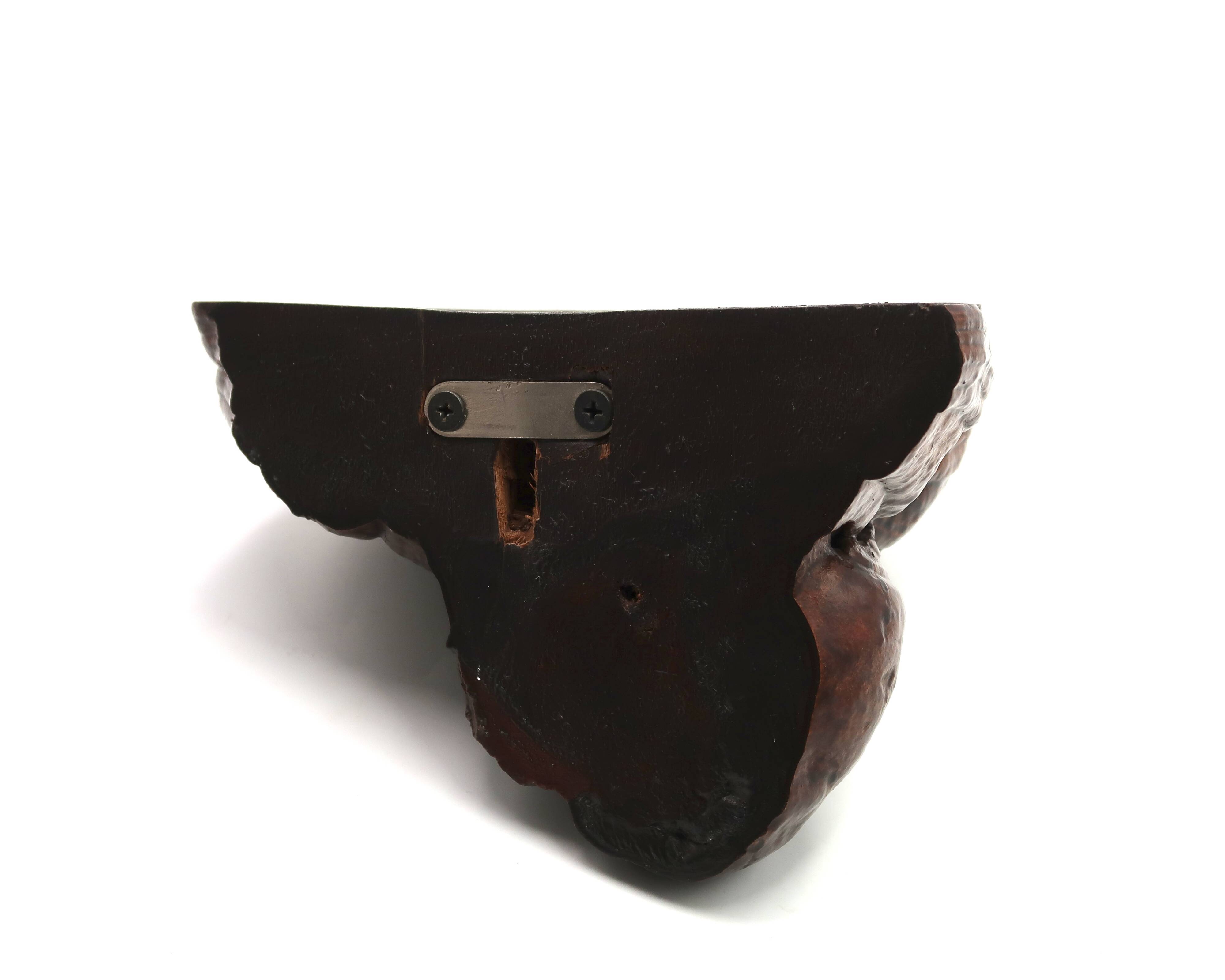 Natural mushroom-shaped wall shelf in dark wood, 1970s.
