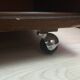 Vintage furniture, bookcase, TV or hi-fi system, sliding door with wheels