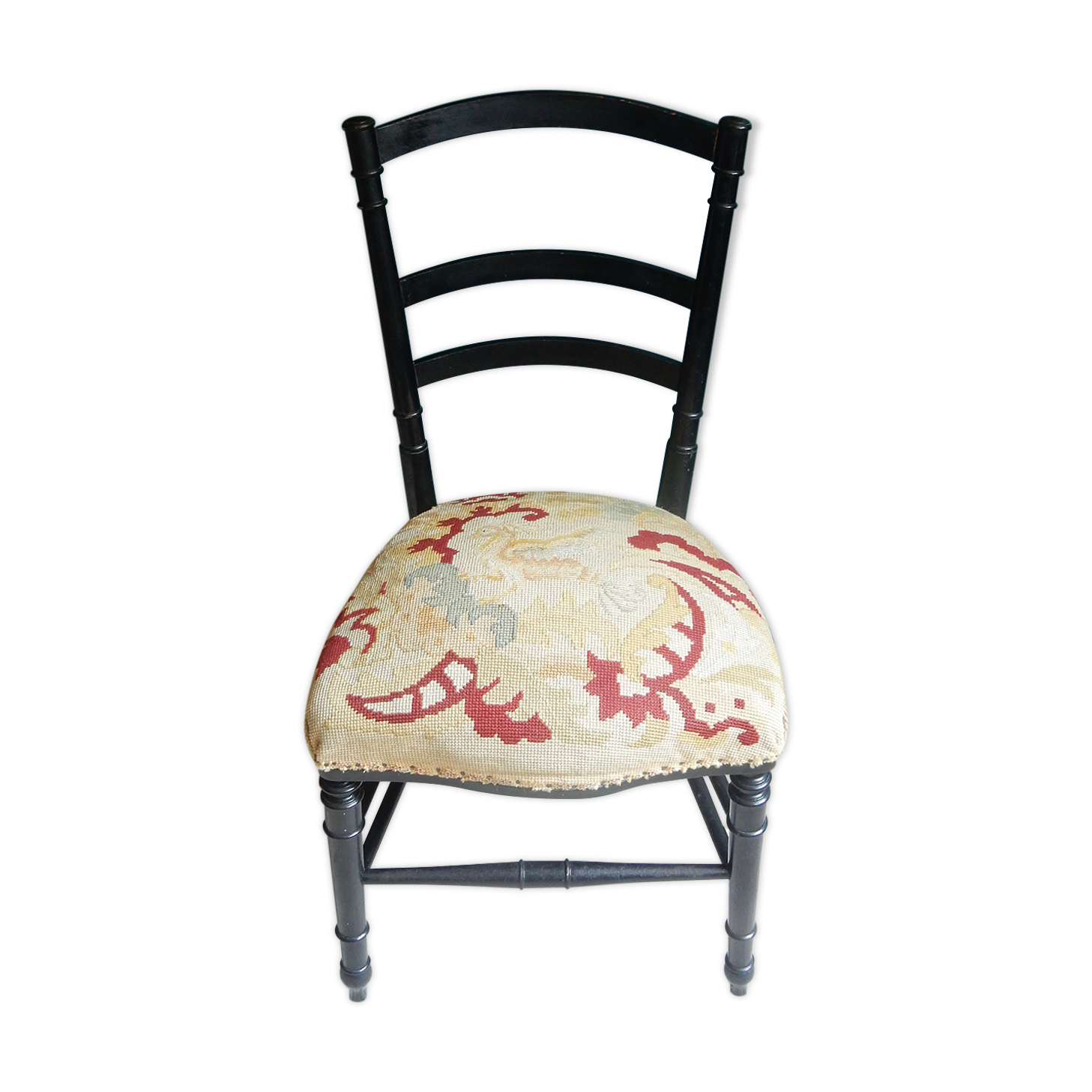 Black Napoleon III chair lined with phoenix