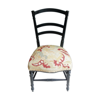 Black Napoleon III chair lined with phoenix