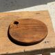 Average circular teak monoxyle chopping board with handle 26 x 18.
