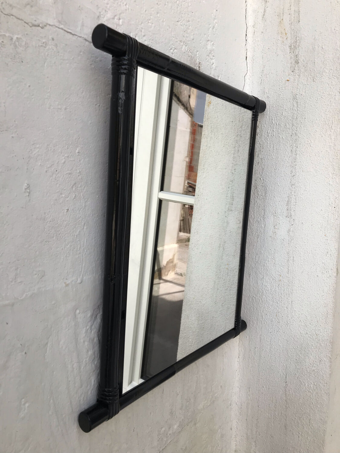 Black lacquered rattan mirror