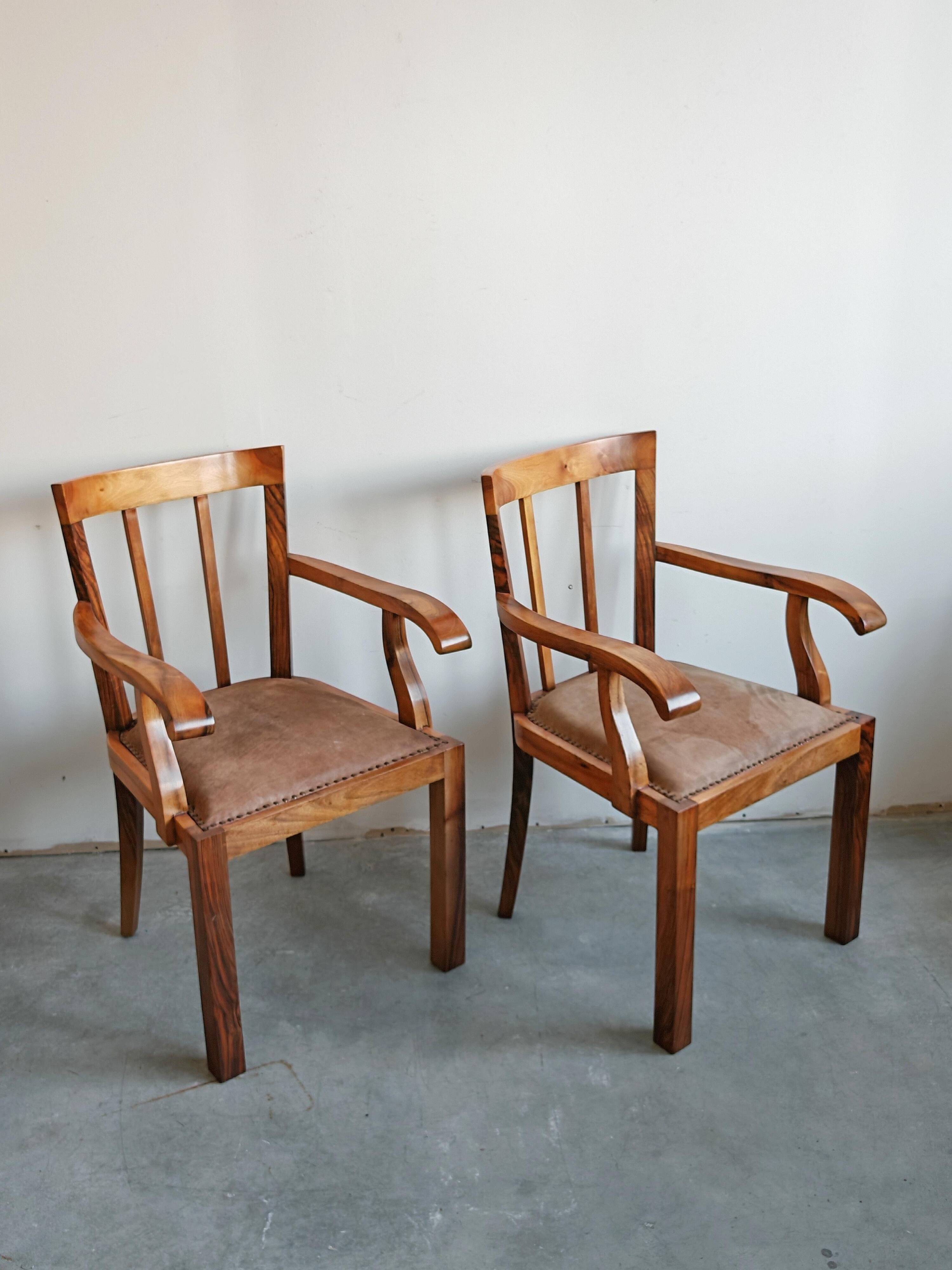 Pair of Art Deco armchairs in solid walnut and leather, 1920s