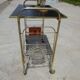 Serving trolley, vinyl record holder in golden brass