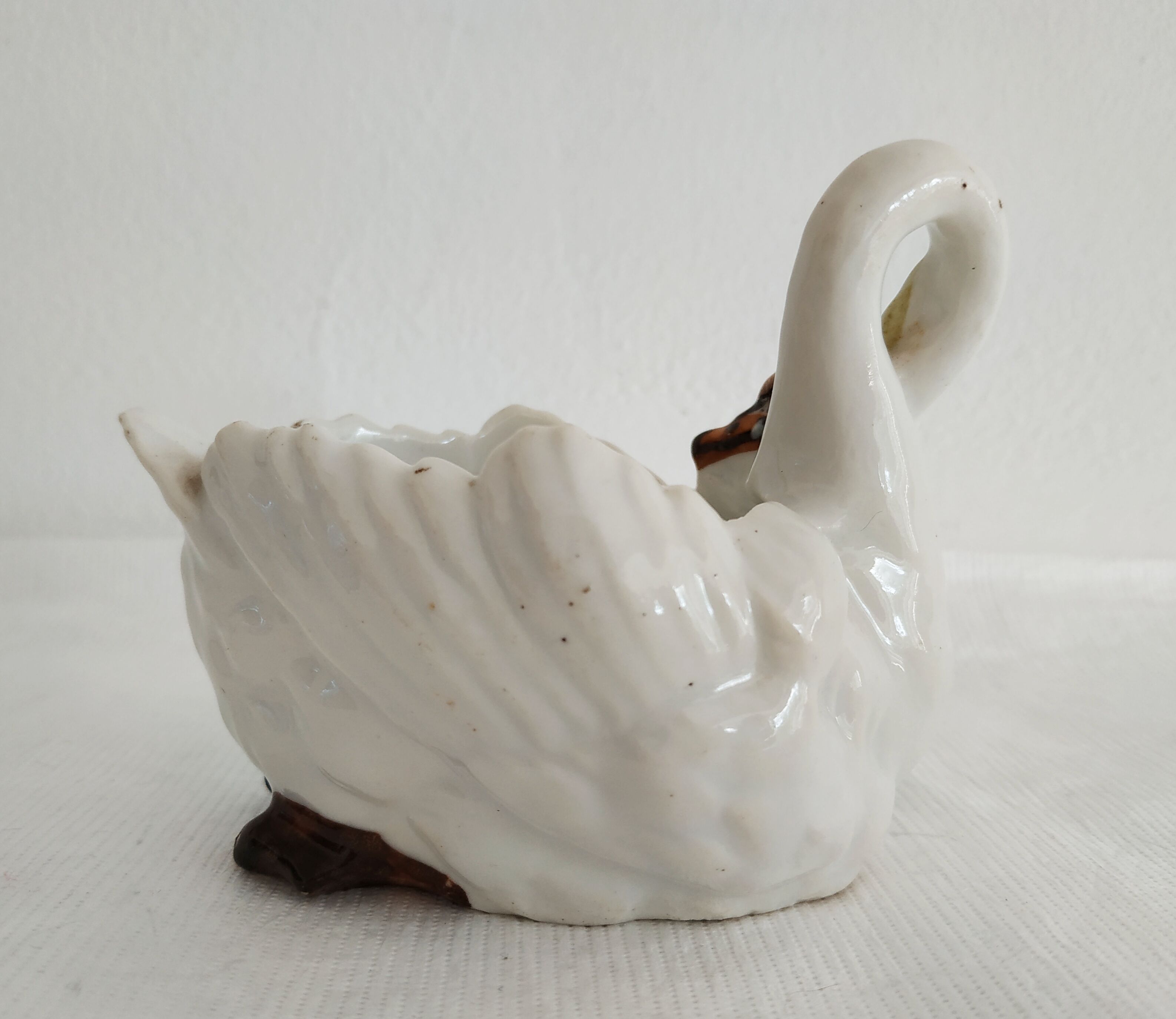 Mustard and salty swans, circa 1900