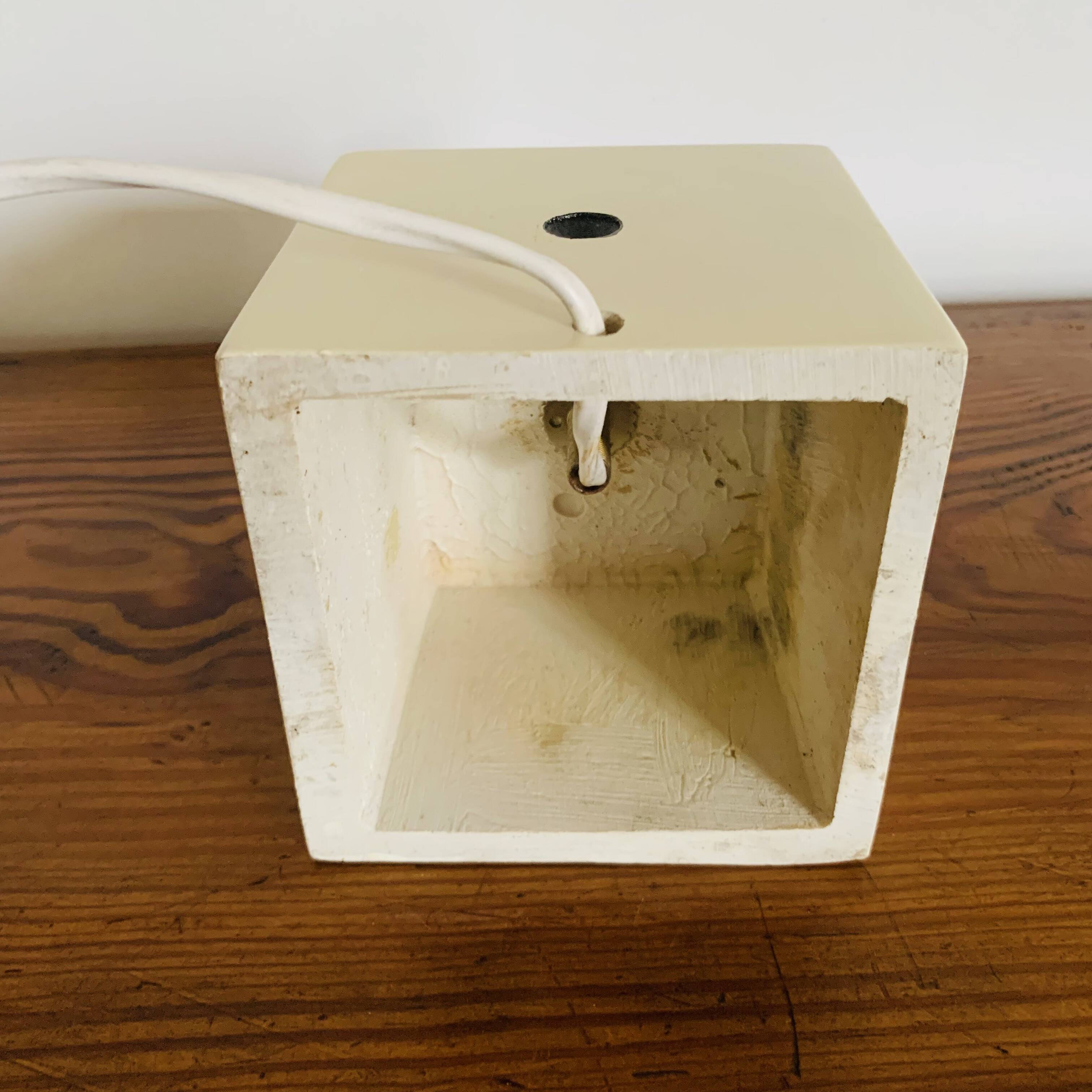 Lamp base representing a die