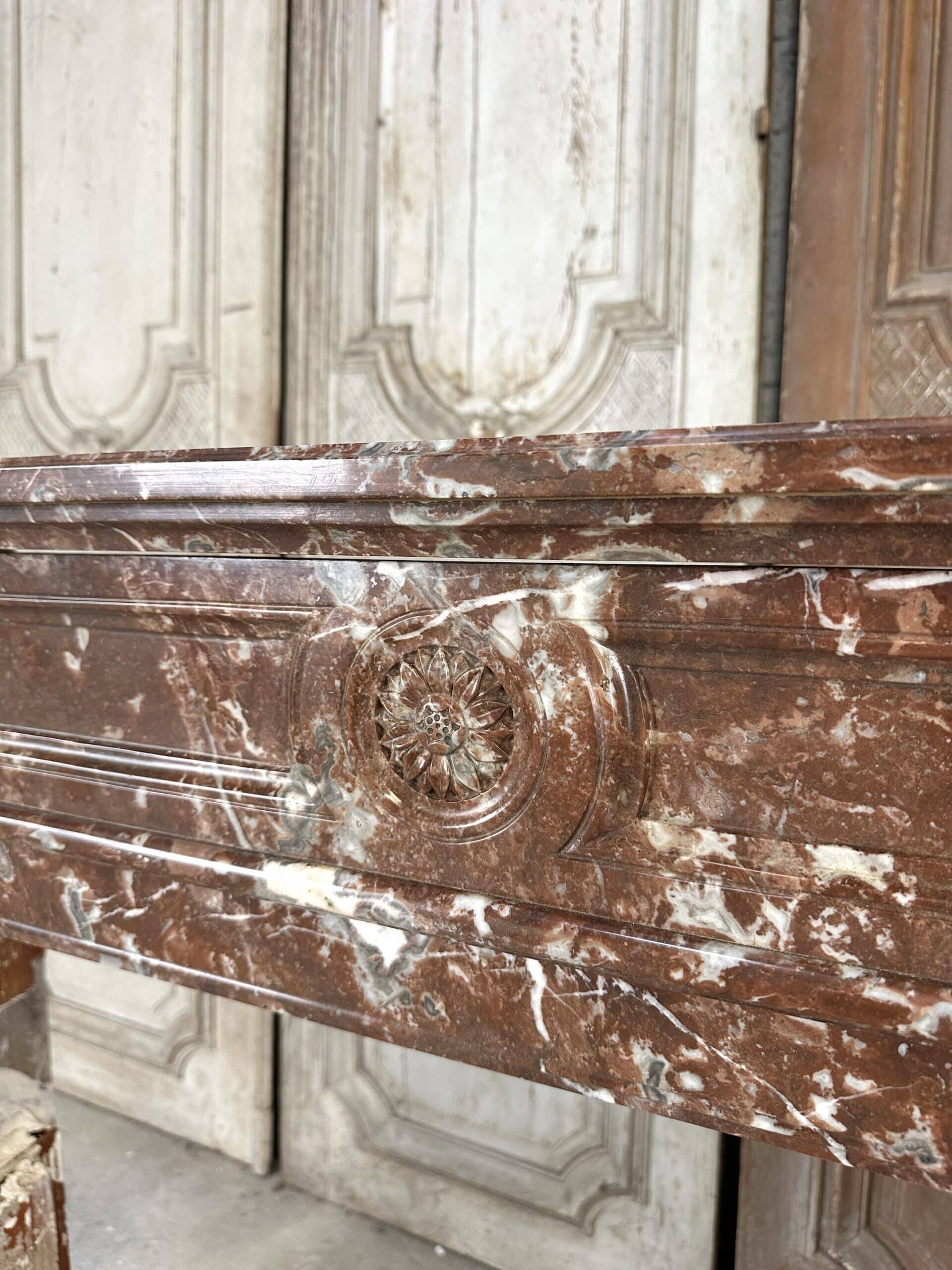 Red marble fireplace in the Louis XVI style, late 19th century