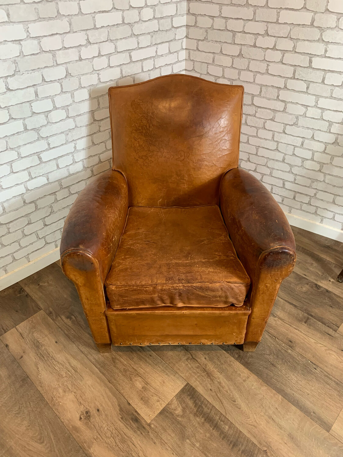 Club armchair in leather 1930
