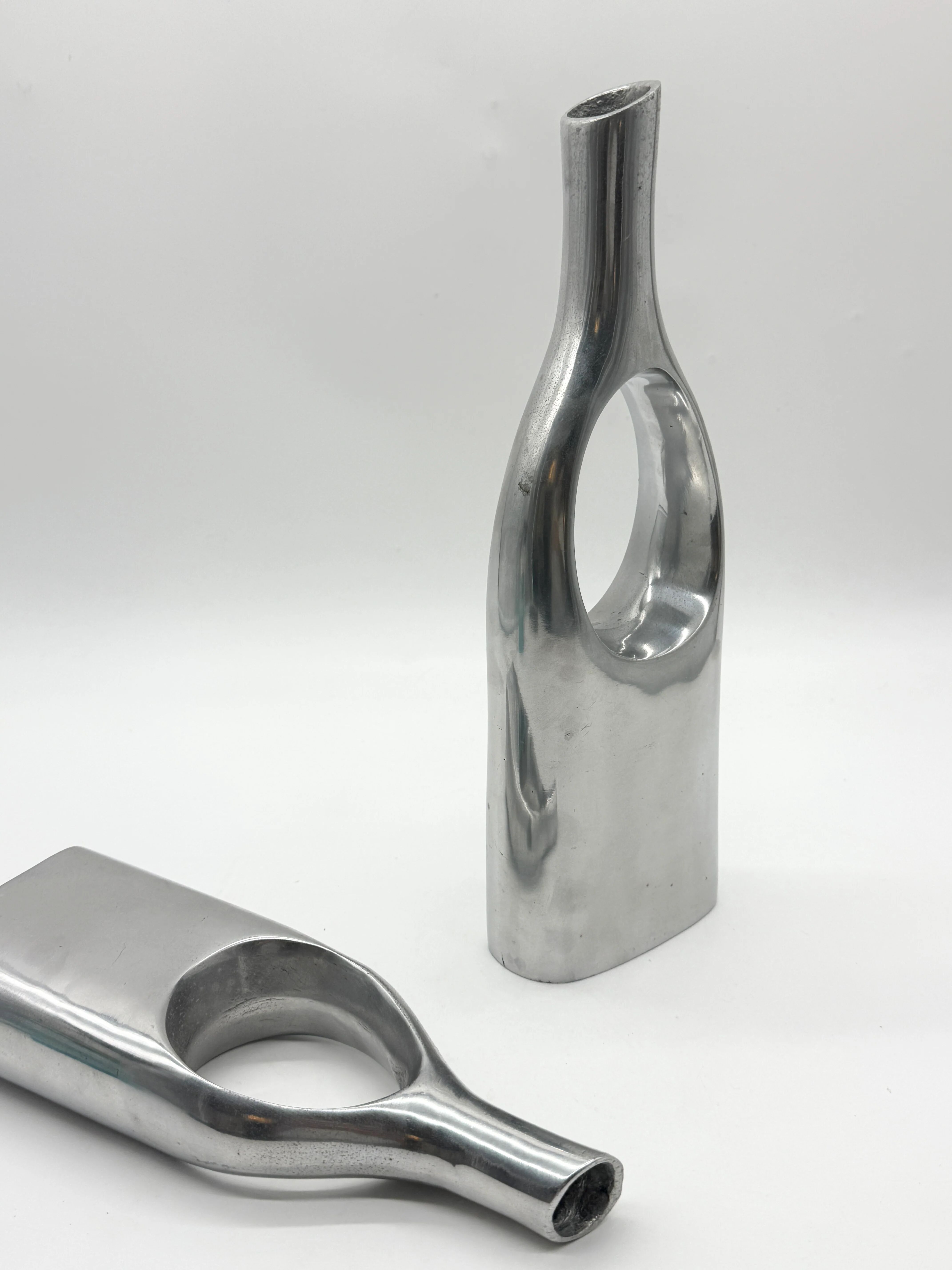 Pair of "drop" vases in aluminium cast, Italy, 1970s