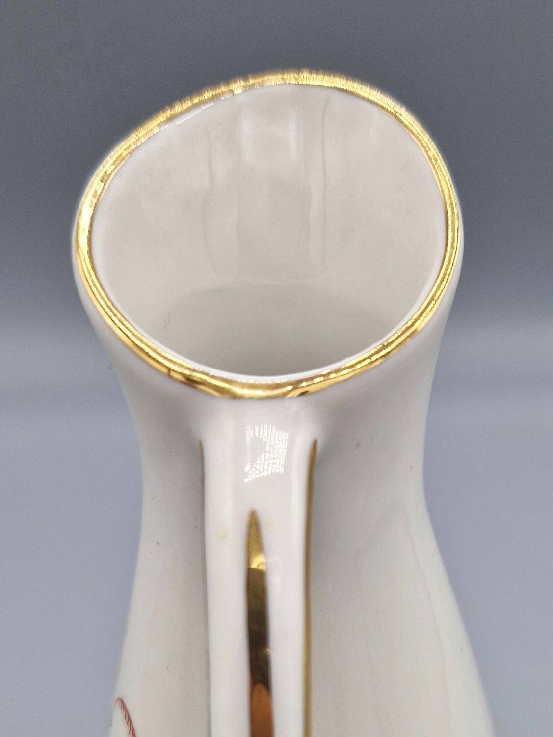 Hand painted German porcelain pitcher with floral design and gold trim