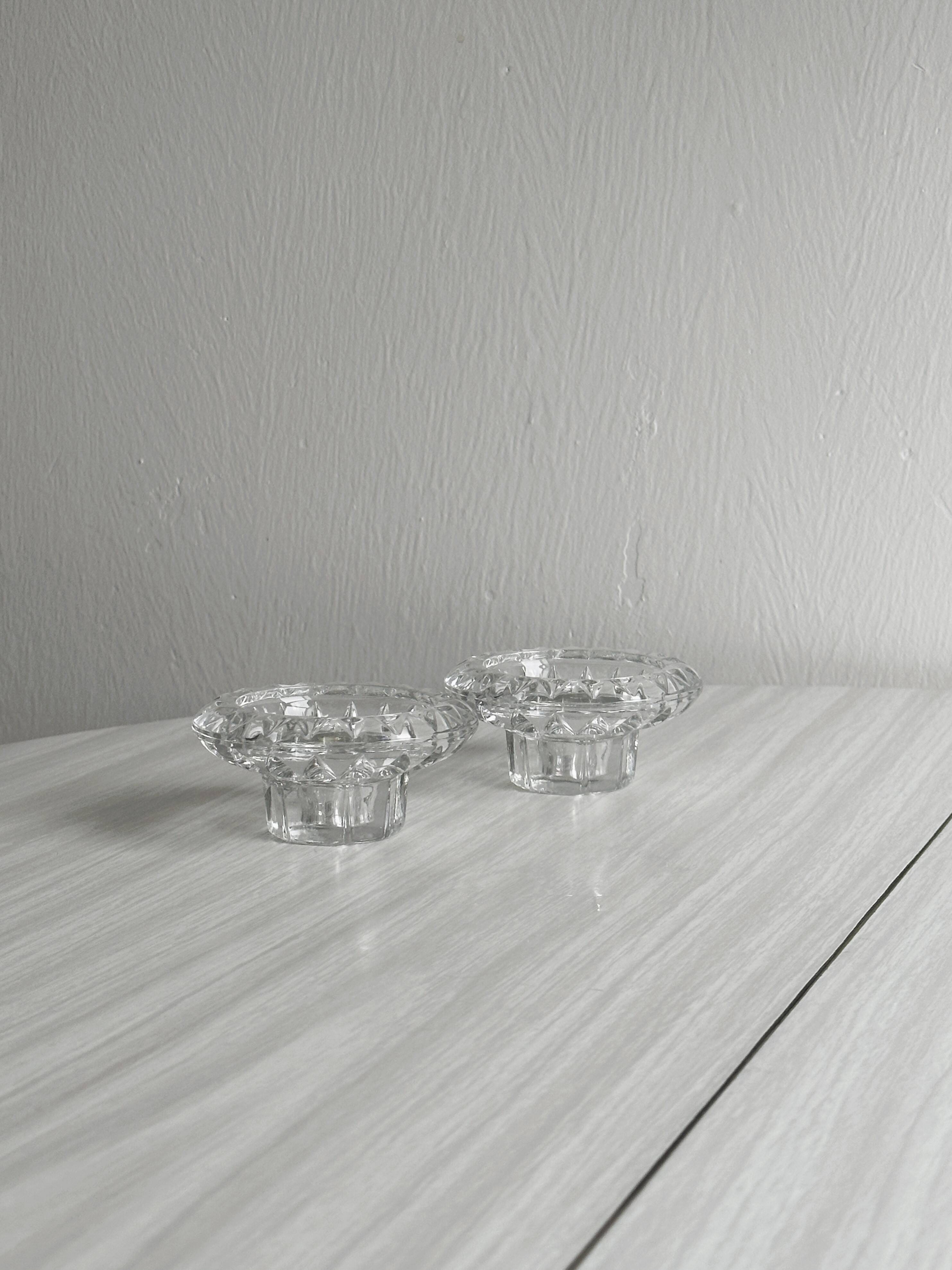 Duo of small candlesticks in chiseled glass