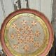 Pink and golden Florentine round top