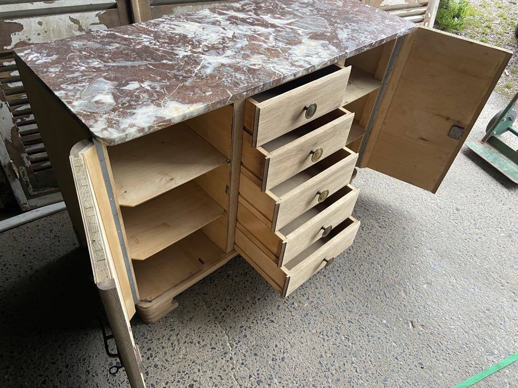 Raw wood chest of drawers with marble top