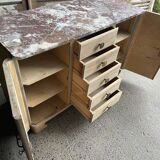 Raw wood chest of drawers with marble top