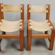 Pair of elm and leather chairs by Maison Regain