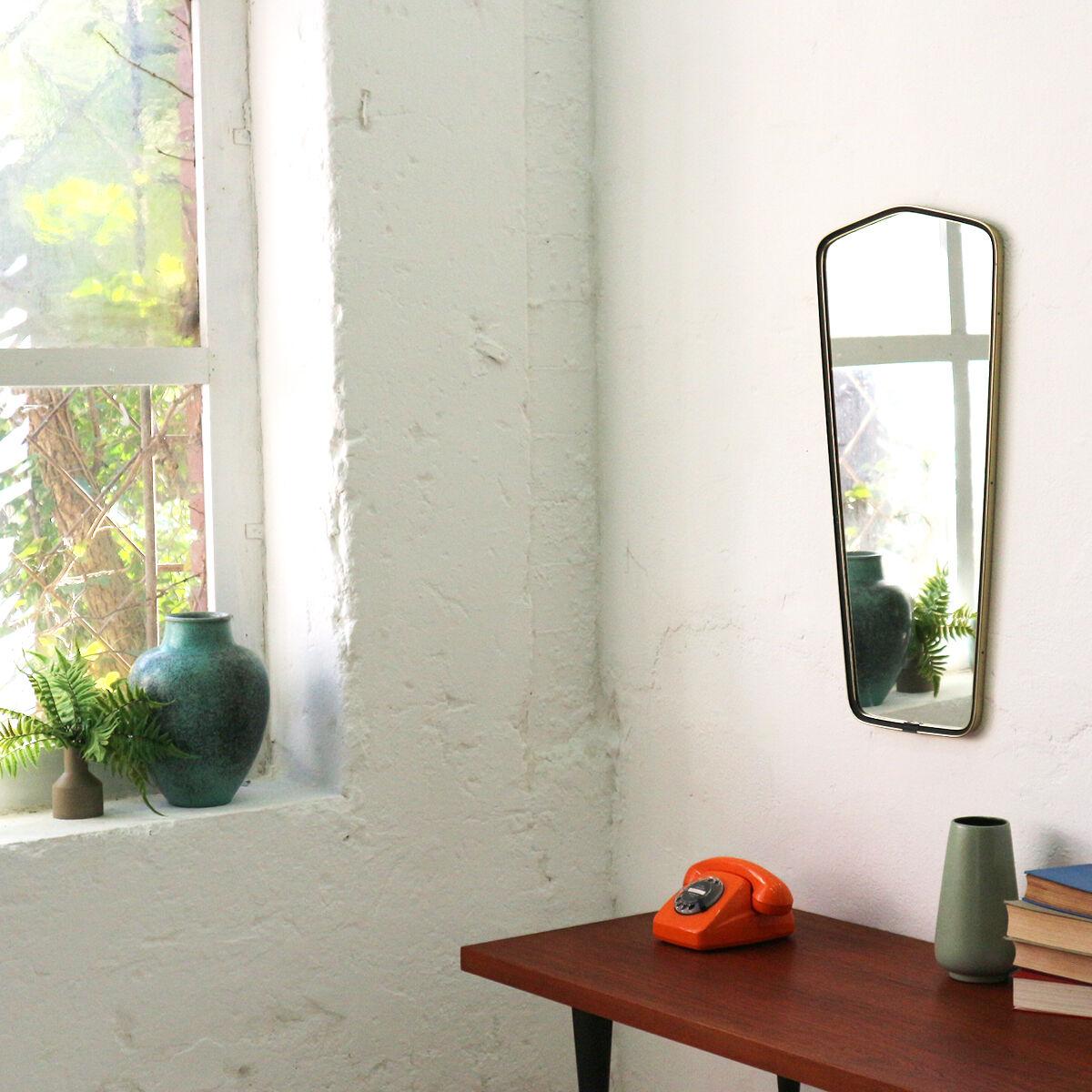 '50s wall mirror with relief brass frame