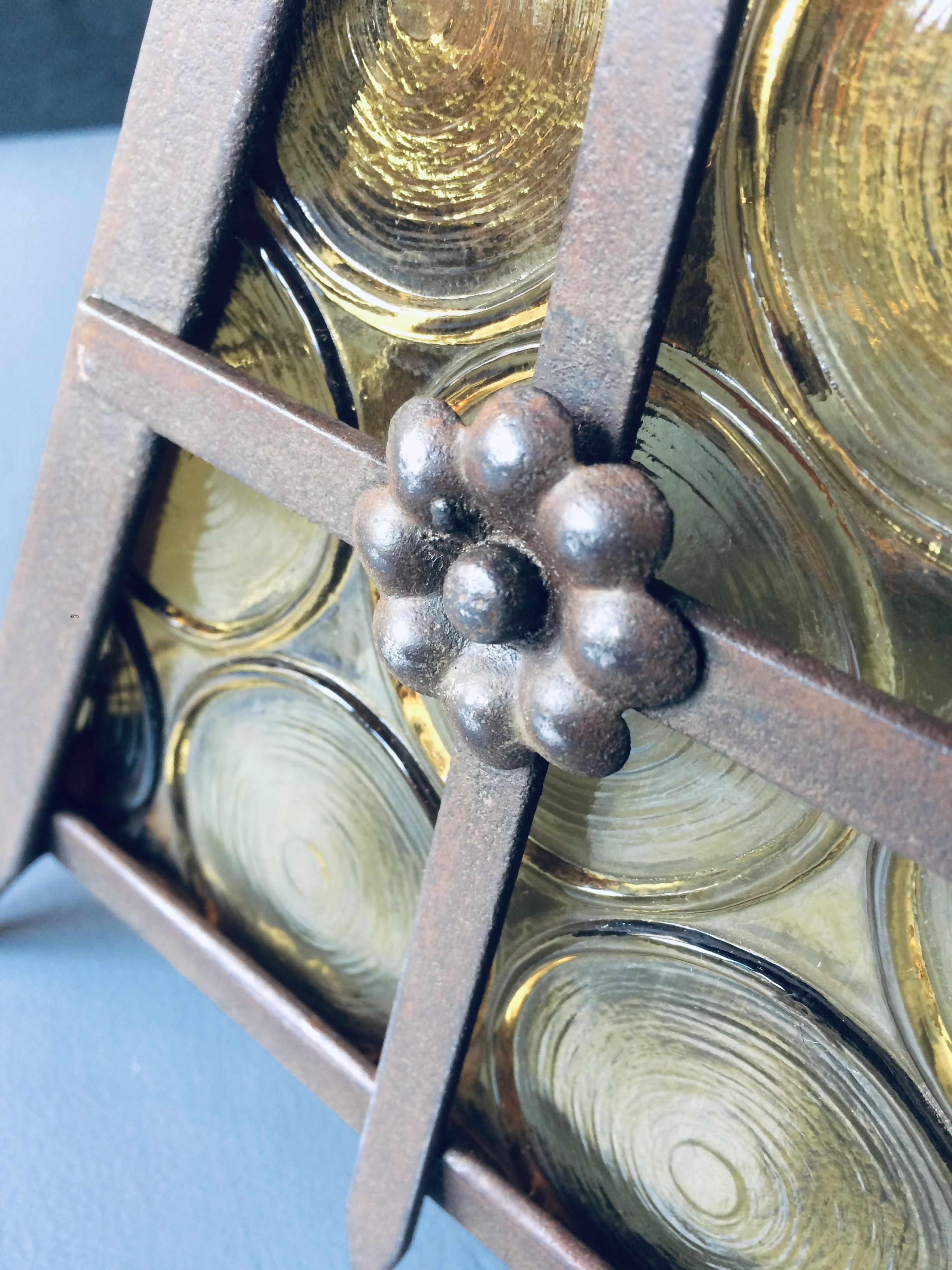 Old solid steel hanging and round-ornamented yellow glazing