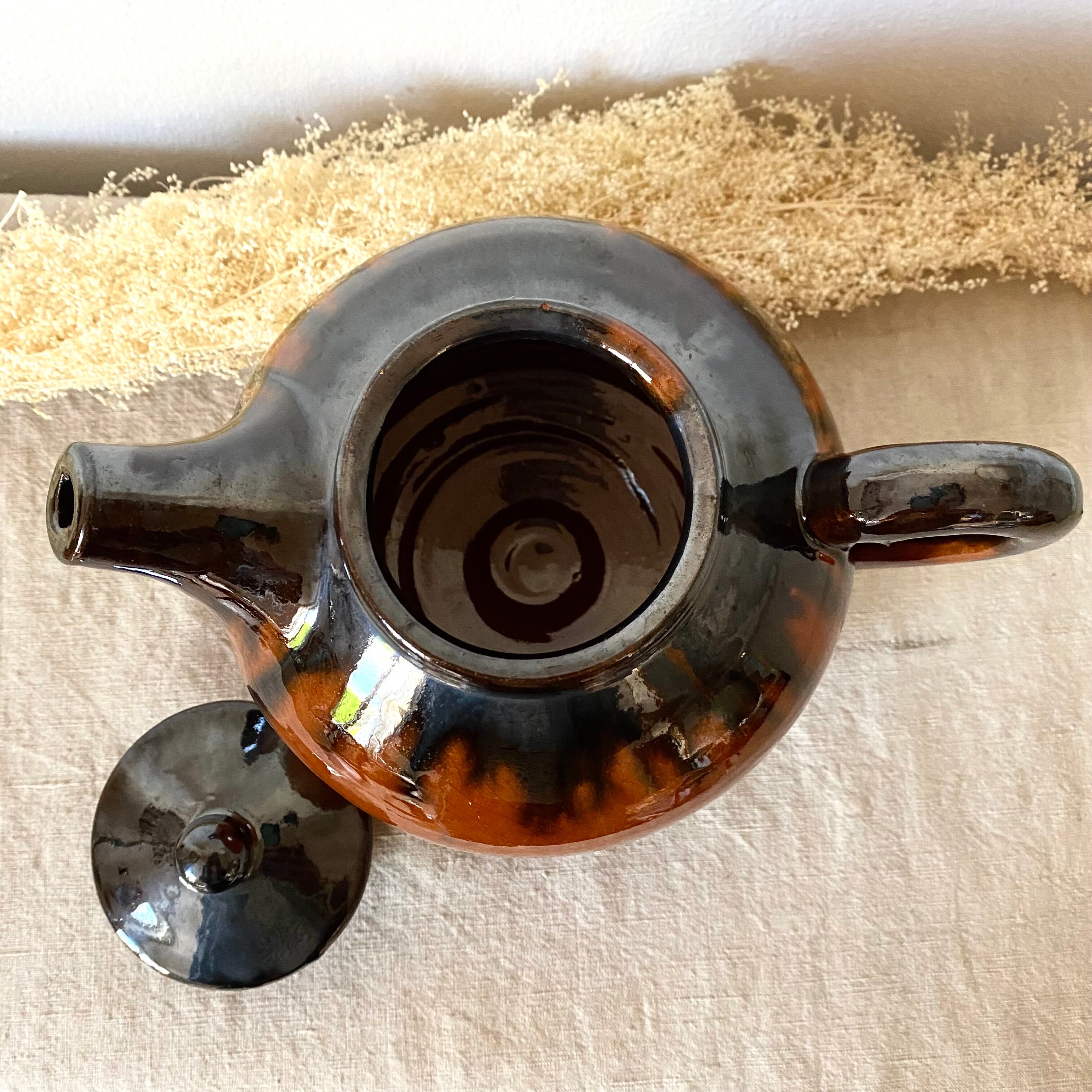 Glazed terracotta teapot
