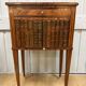 Side table with a faux book front.