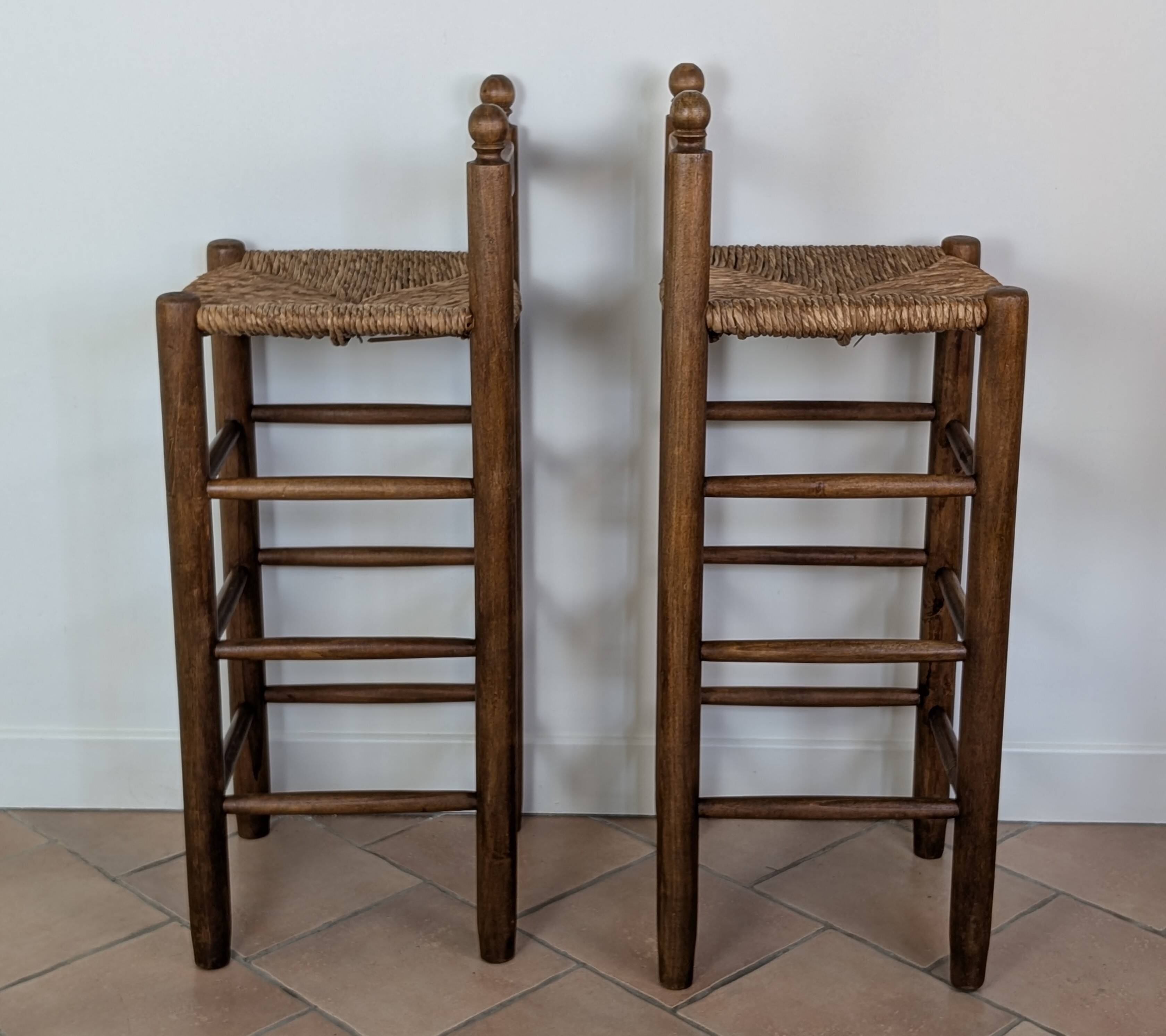 High wooden and straw stools