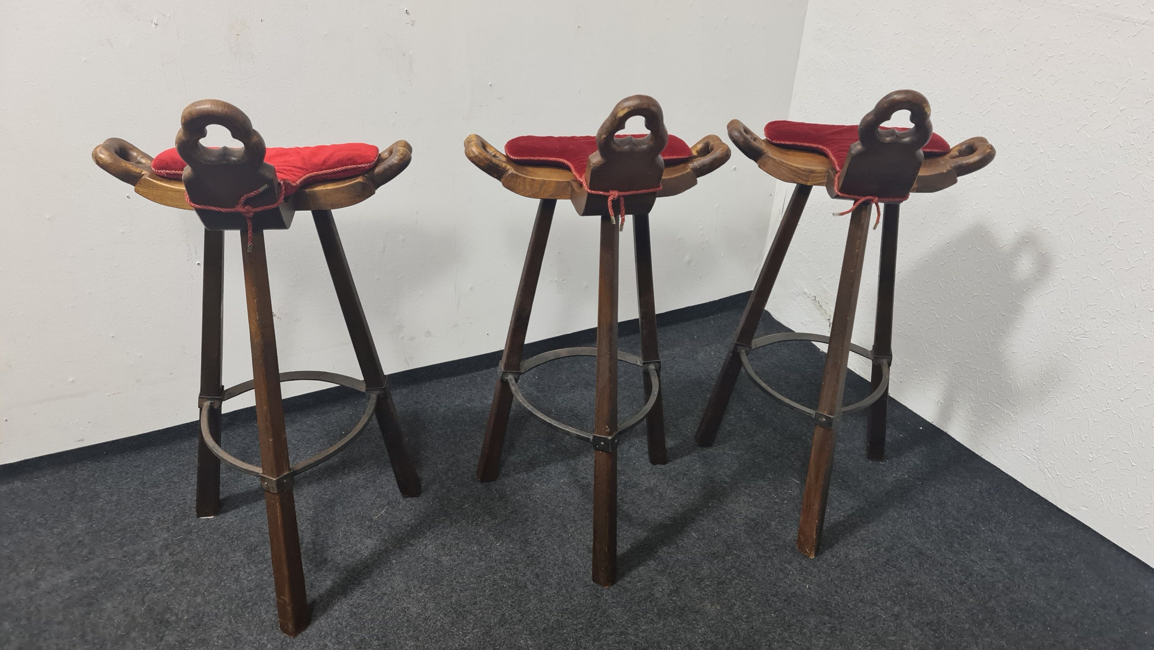 Three vintage Spanish bar stools