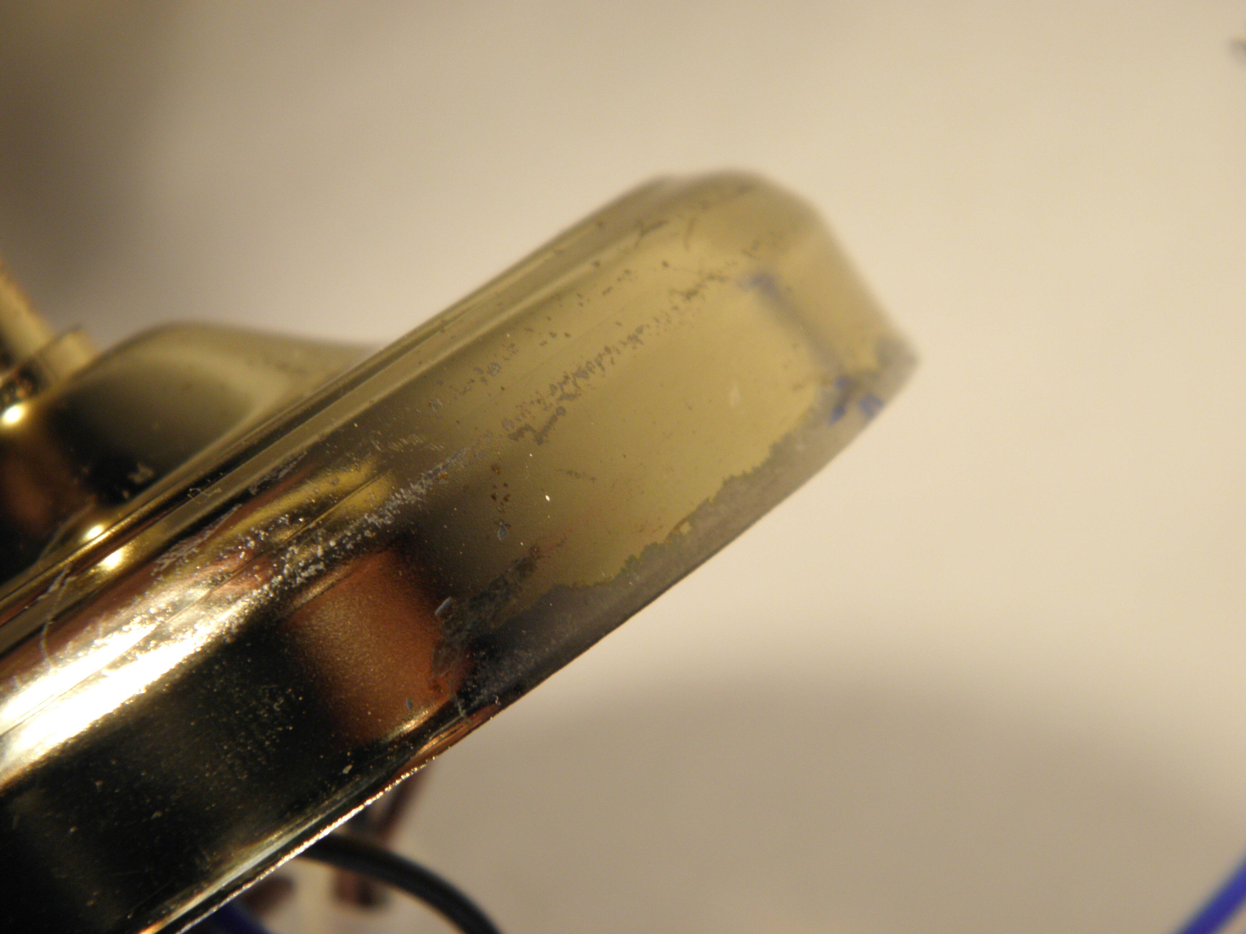 Two gold metal picture sconces