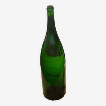 Green blown glass bottle of 58 cm.