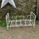 Old wrought iron doll bed